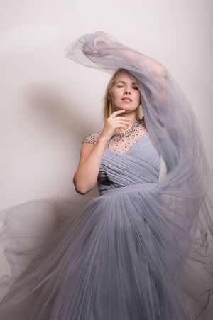 Young beautiful stylish girl posing in studio.の写真素材