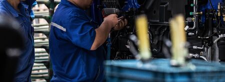 Workers in machinery factory in China.