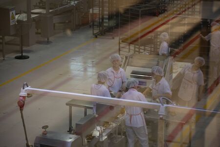 BEIJING, Ð¡HINA - JUNE 01, 2019: Industrial production of bread baking factory in China.のeditorial素材