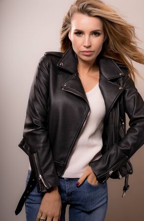 Young beautiful stylish girl posing in studio.の写真素材