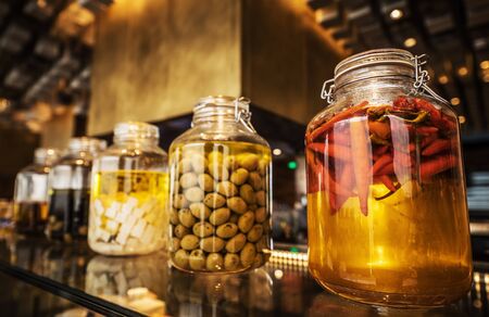 Glassware with canned food and cooking ingredients.