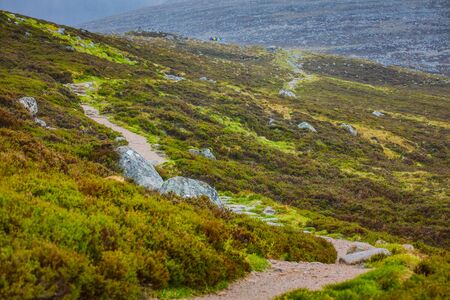 Beautiful scenic landscape of amazing Scotland nature and mountain trail roadの写真素材