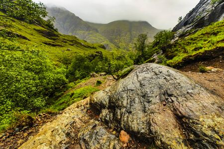 Beautiful scenic landscape of Scotland nature with mountain rocksの写真素材