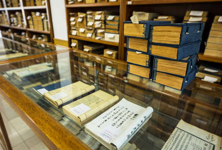BEIJING, Ð¡HINA - JUNE 01, 2019: Traditional Chinese library with shelves of old and modern books.のeditorial素材