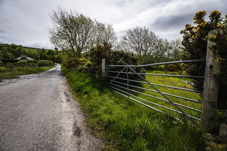 Beautiful scenic landscape of amazing Scotland nature and mountain trail roadの写真素材
