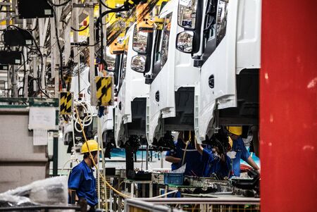 Workers in machinery factory in China.の写真素材