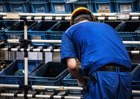 Workers in machinery factory in China.の写真素材