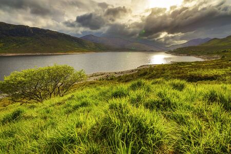 Beautiful scenic landscape of Scotland nature with beautiful evening sun set sky