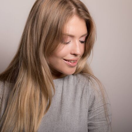 Young beautiful stylish girl posing in studio.の写真素材
