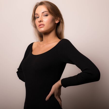 Young beautiful stylish girl posing in studio.の写真素材