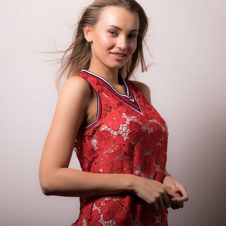 Young beautiful stylish girl posing in studio.の写真素材