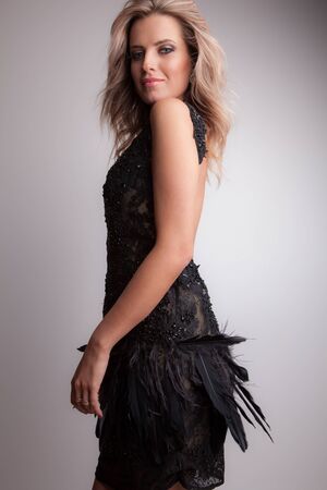 Young beautiful stylish girl posing in studio.の写真素材