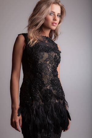 Young beautiful stylish girl posing in studio.の写真素材