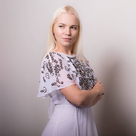Young beautiful stylish girl posing in studio.の写真素材