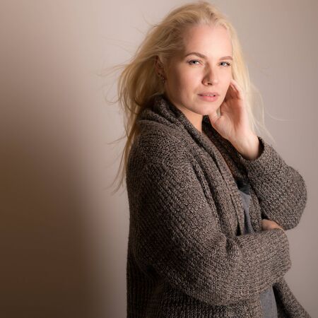 Young beautiful stylish girl posing in studio.の写真素材