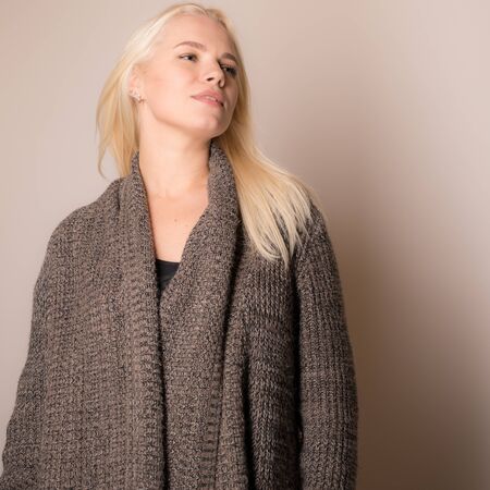 Young beautiful stylish girl posing in studio.の写真素材