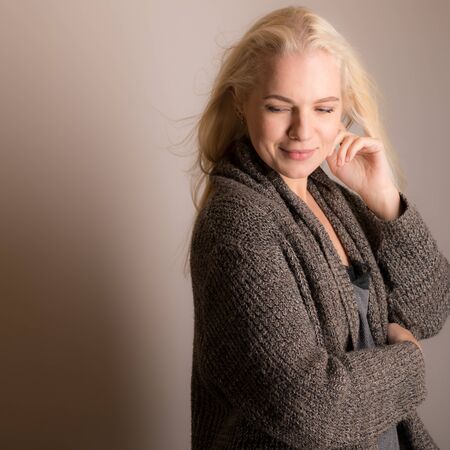 Young beautiful stylish girl posing in studio.の写真素材