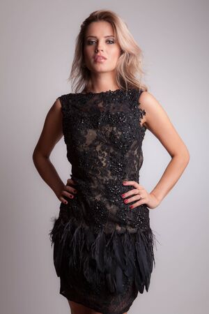 Young beautiful stylish girl posing in studio.の写真素材