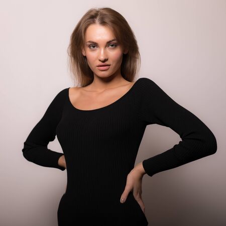 Young beautiful stylish girl posing in studio.の写真素材