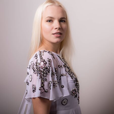 Young beautiful stylish girl posing in studio.の写真素材