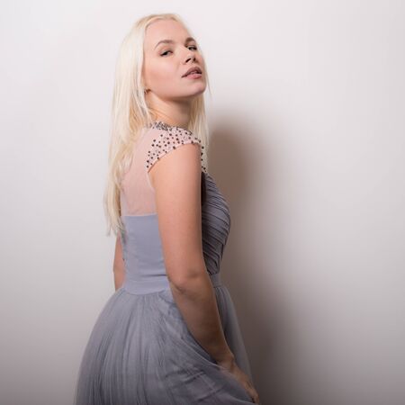 Young beautiful stylish girl posing in studio.の写真素材