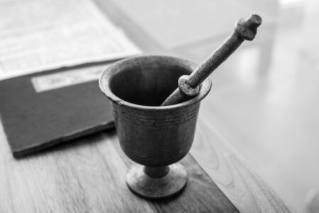 Vintage traditional pharmacy scales kettlebell black-white photo.の写真素材
