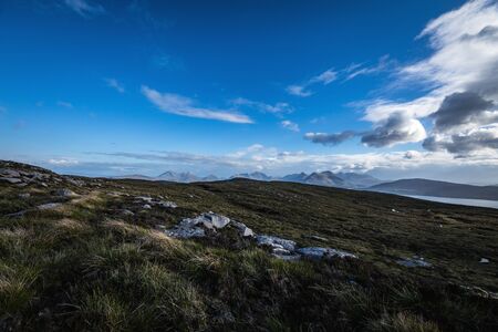 Beautiful mountains landscape of Scotland nature with beautiful evening cloudy sky.の写真素材
