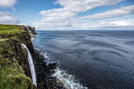 Picturesque landscape of a mountain waterfall and traditional nature of Scotlandの写真素材