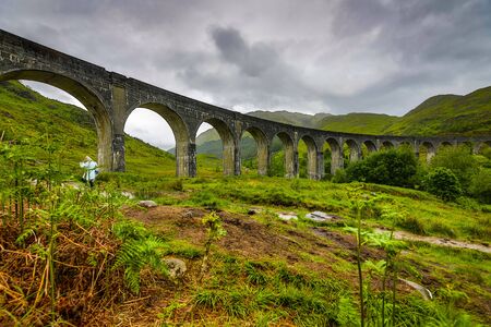 Old bridge and picturesque Scotland morning landscapeの写真素材