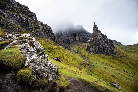 Old Man of Storr on the Isle of Skye in Scotland. Mountain landscape with foggy cloudsの写真素材