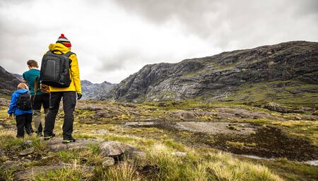 Traveler walk against beautiful Scotland nature photo.の写真素材