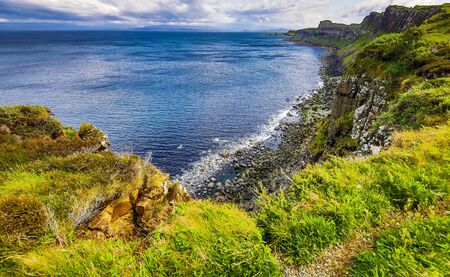 Waves breaking on coastal cliffs of Scotland.の写真素材