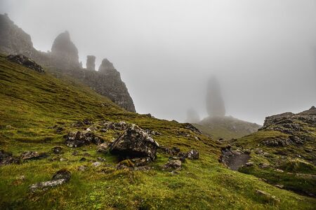Old Man of Storr on the Isle of Skye in Scotland. Mountain landscape with foggy clouds.の写真素材