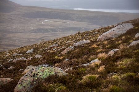Beautiful mountains landscape of Scotland nature with beautiful evening cloudy sky.の写真素材