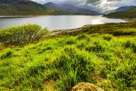 Beautiful scenic landscape of Scotland nature with beautiful evening sun set skyの写真素材