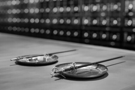 Vintage traditional pharmacy scales kettlebell black-white photoの写真素材