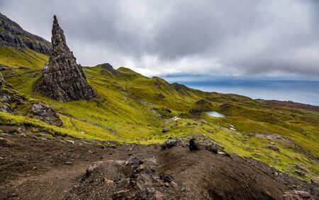 Old Man of Storr on the Isle of Skye in Scotland. Mountain landscape with foggy cloudsの写真素材