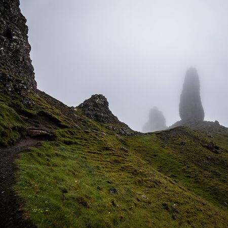 Old Man of Storr on the Isle of Skye in Scotland. Mountain landscape with foggy cloudsの写真素材