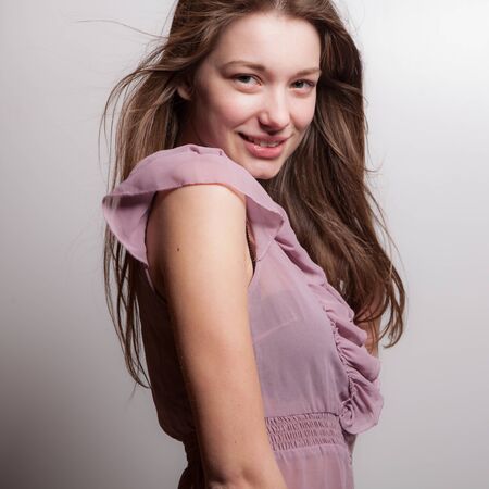 Young beautiful stylish girl posing in studio.の写真素材