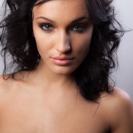Young beautiful stylish girl posing in studio.の写真素材