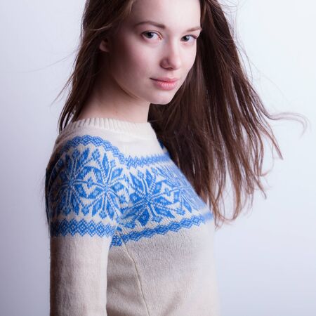 Young beautiful stylish girl posing in studio.の写真素材