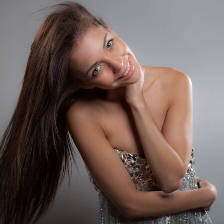 Young beautiful stylish girl posing in studio.の写真素材