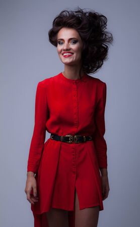 Young beautiful stylish girl posing in studio.の写真素材