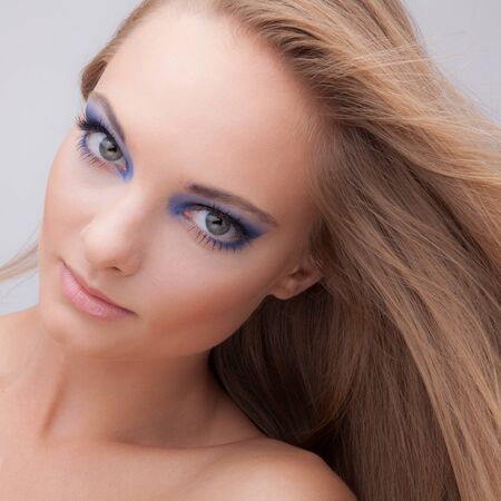 Young beautiful stylish girl posing in studio.の写真素材