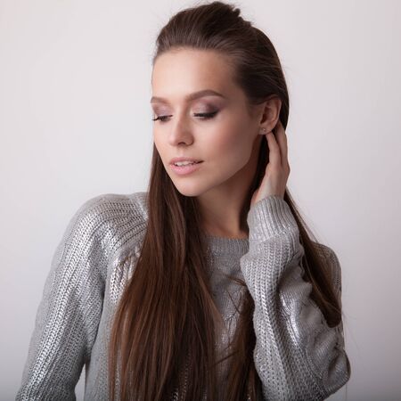 Young beautiful stylish girl posing in studio.の写真素材