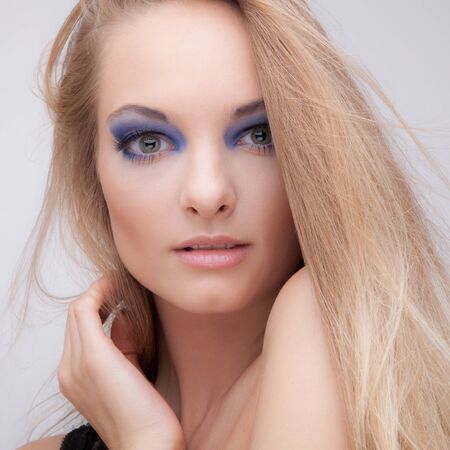 Young beautiful stylish girl posing in studio.の写真素材