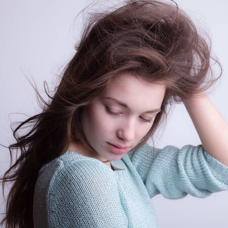 Young beautiful stylish girl posing in studio.の写真素材