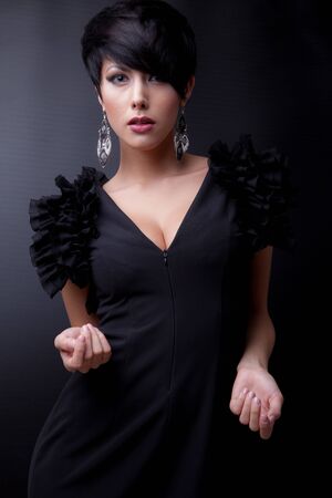 Young beautiful stylish girl posing in studio.の写真素材