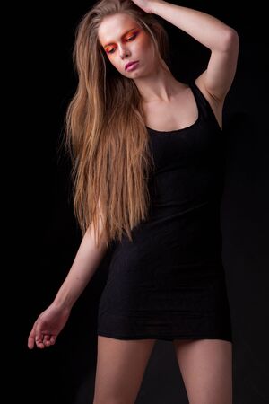 Young beautiful stylish girl posing in studio.の写真素材