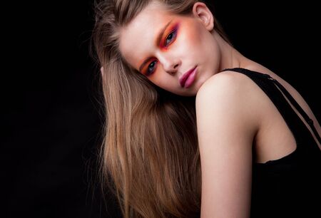 Young beautiful stylish girl posing in studio.の写真素材